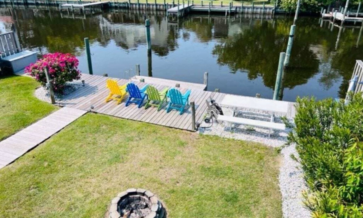 Colington Harbour House | Waterfront! Game Room, Hot Tub, Kayaks, YMCA, Theater Room, Fire Pit, Dogs OK!
