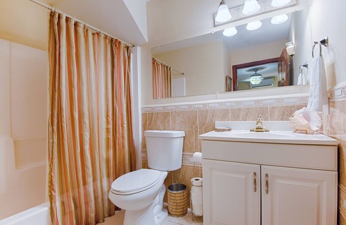Orchid Beach Village House | Beachfront Between West Bay & West End Pool, Dock & Sunset Views