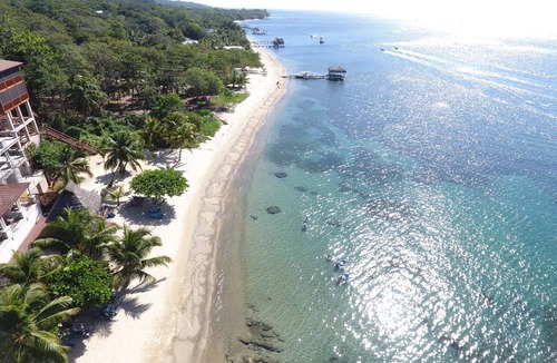 Orchid Beach Village House | Beachfront Between West Bay & West End Pool, Dock & Sunset Views