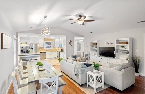 Colington Harbour House | Waterfront! Game Room, Hot Tub, Kayaks, YMCA, Theater Room, Fire Pit, Dogs OK!