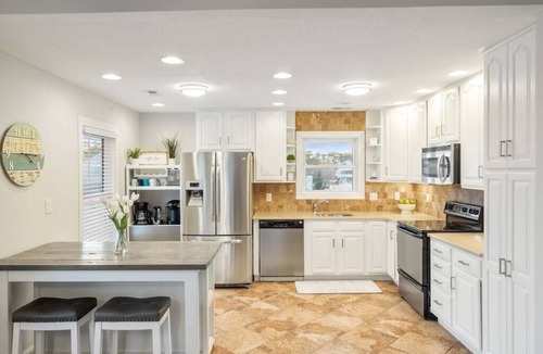 Colington Harbour House | Waterfront! Game Room, Hot Tub, Kayaks, YMCA, Theater Room, Fire Pit, Dogs OK!