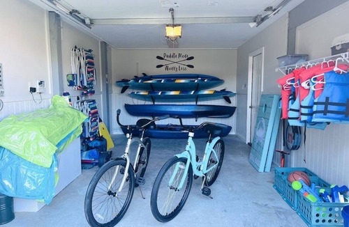 Colington Harbour House | Waterfront! Game Room, Hot Tub, Kayaks, YMCA, Theater Room, Fire Pit, Dogs OK!