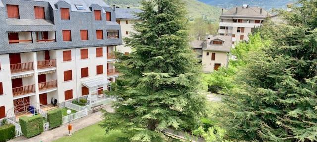 Ático en Biescas con piscina, chimenea y garaje in Biescas