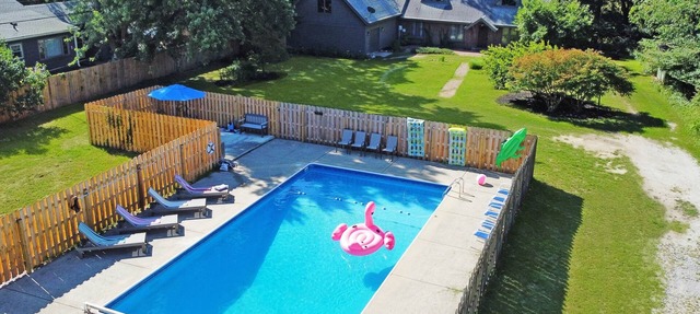 Spacious group getaway with heated pool, sauna, basketball court, and firepit. Sleeps up to 15 guests and is just minutes from Lake Michigan beaches and downtown St. Joseph. Perfect for family vacations, group trips, and relaxing Southwest Michigan. in Benton Harbor